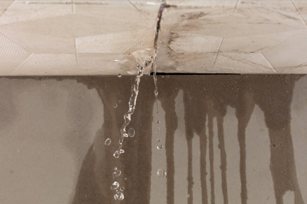 Professional Flood Damage Cleanup technician working in Midfield, AL